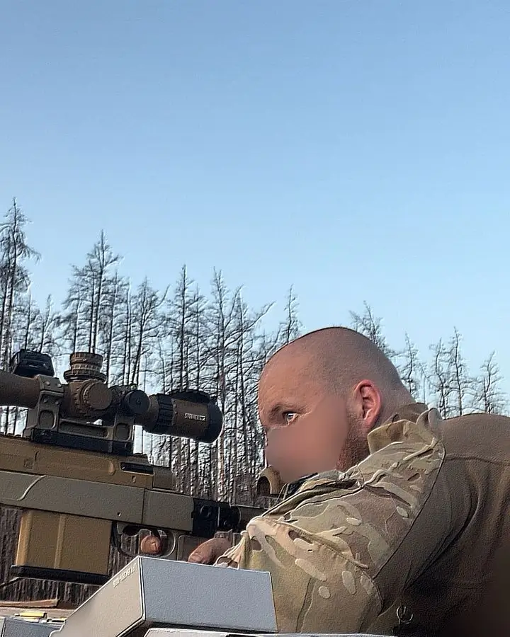 Side view of a Ukrainian soldier with a HLR 338 precision rifle
