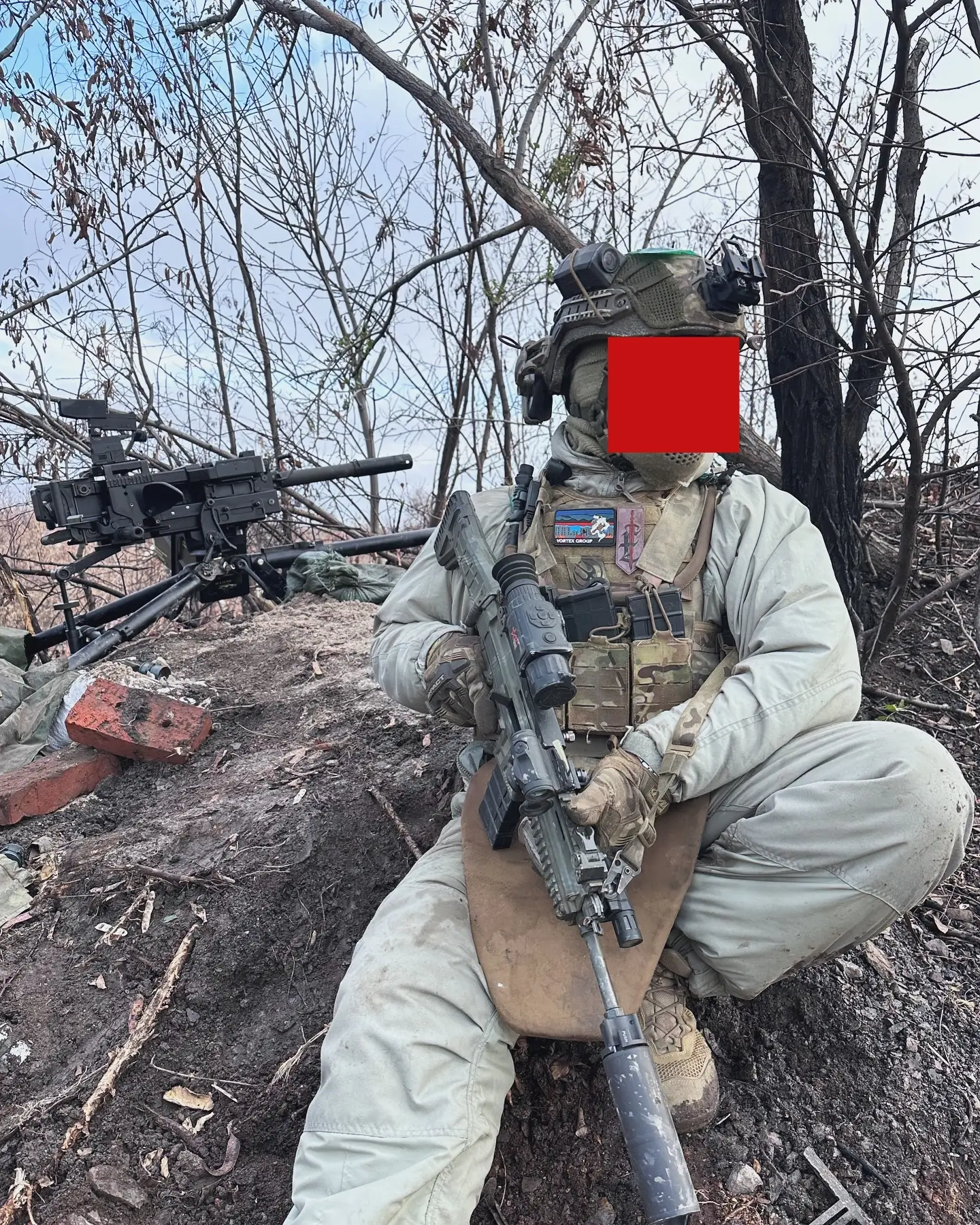 HK GMG in the background of a picture of a Ukrainian soldier
