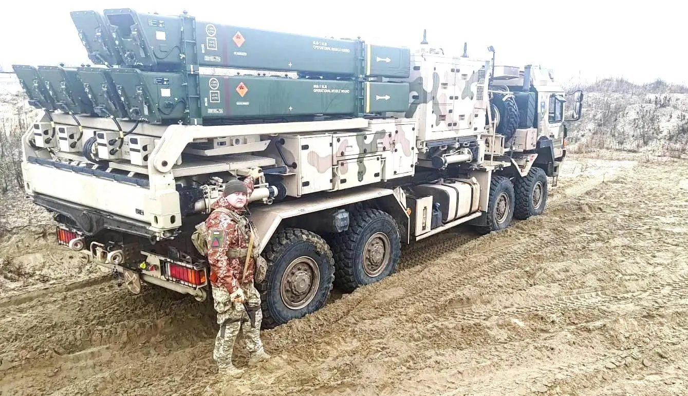 Ukrainian soldier in front of an IRIS-T SLM launcher