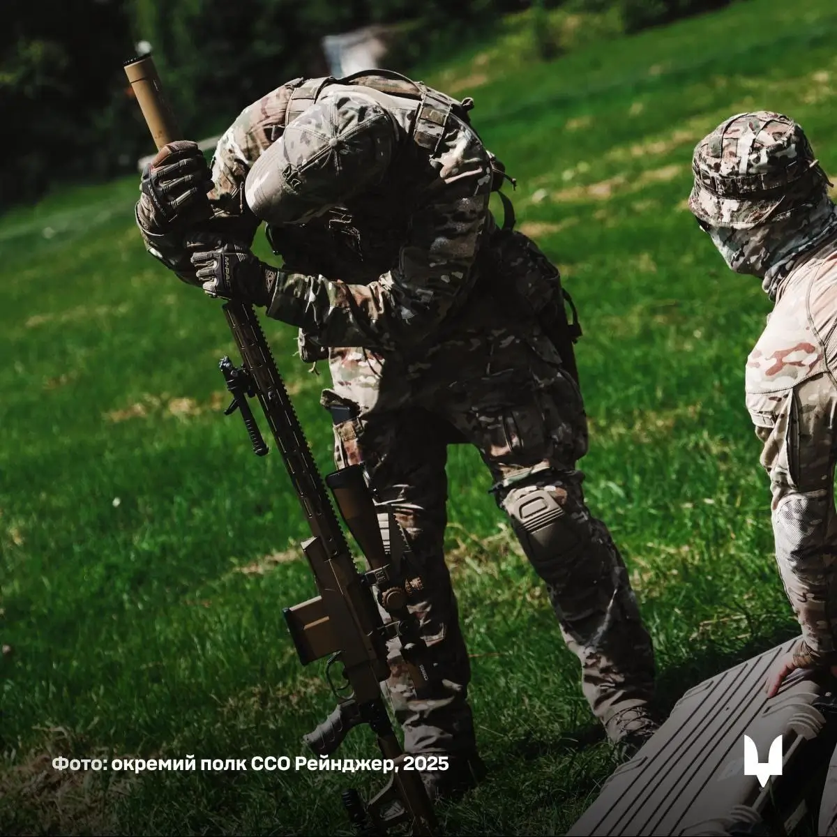 A Ukrainian soldier works with an HLR 338 precision rifle