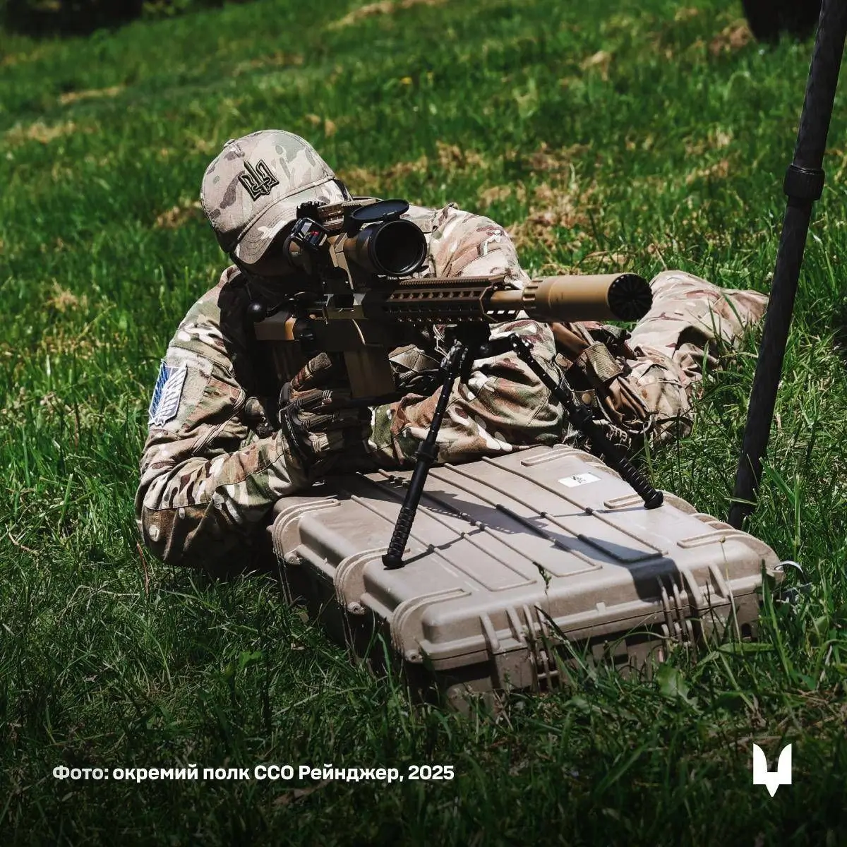 A Ukrainian soldier is working with an HLR 338 precision rifle