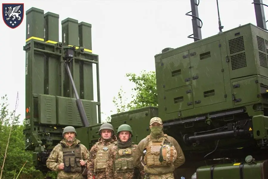 Ukrainian soldiers in front of one of their IRIS-T SLM launchers