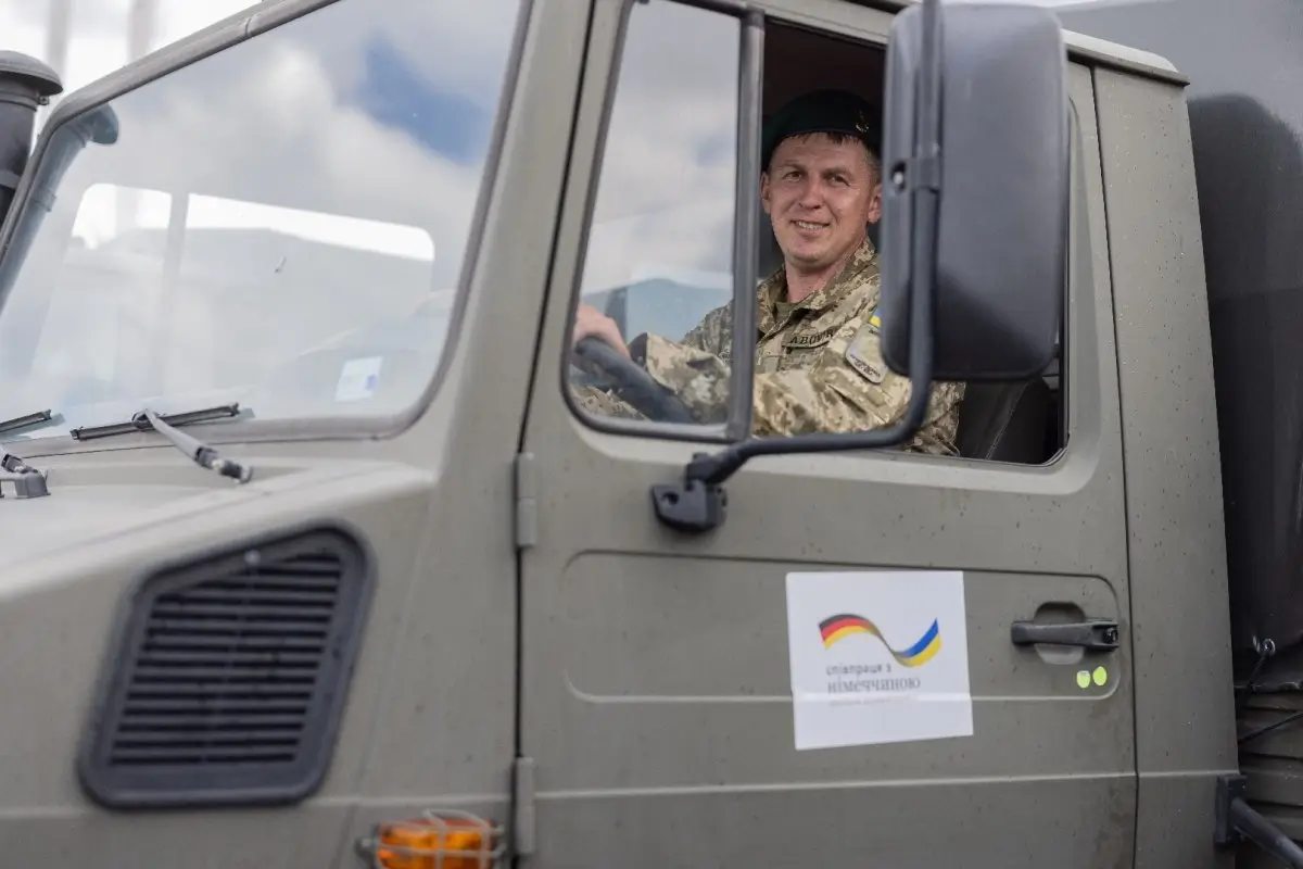 Ukrainian soldier sits inside of one of the Mercedes-Benz Unimogs