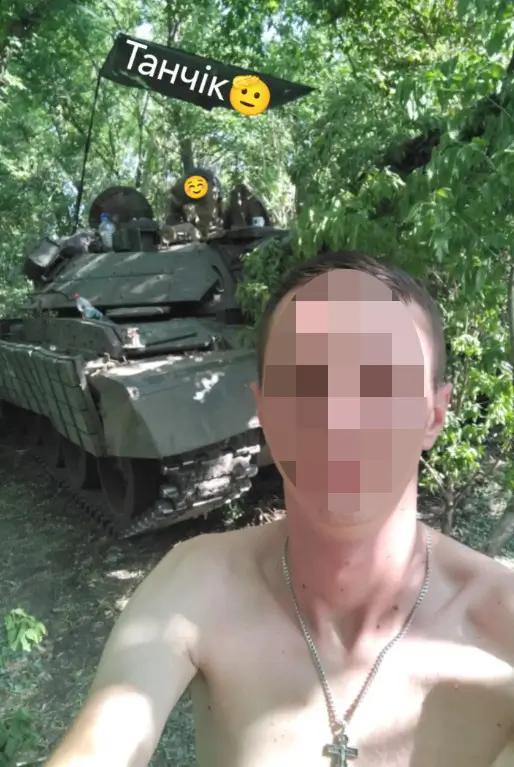 Ukrainian soldier takes a picture of himself in front of his M-55S