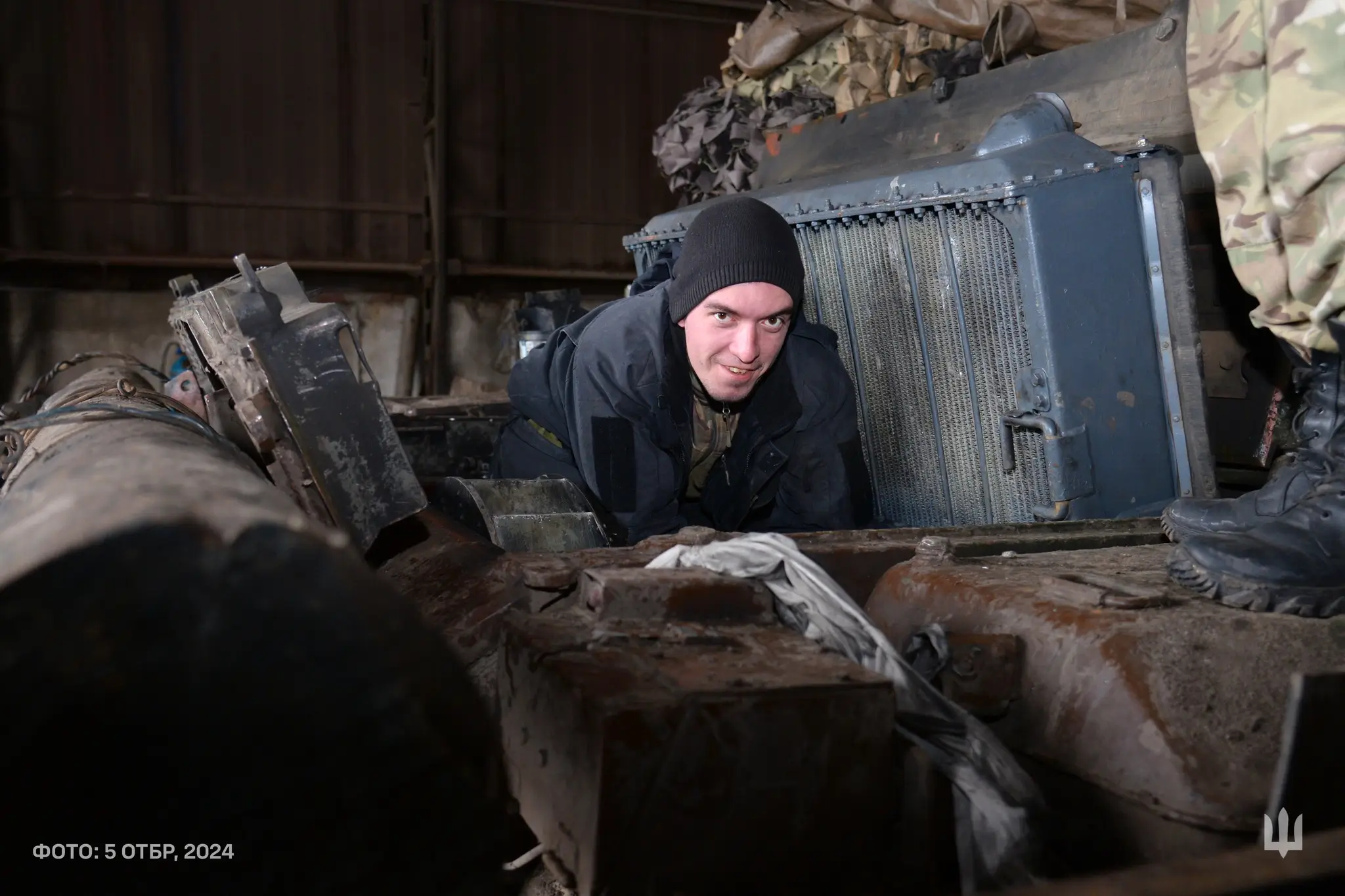 Ukrainian soldier from the 5th Tank Brigade on top of an M-55S MBT