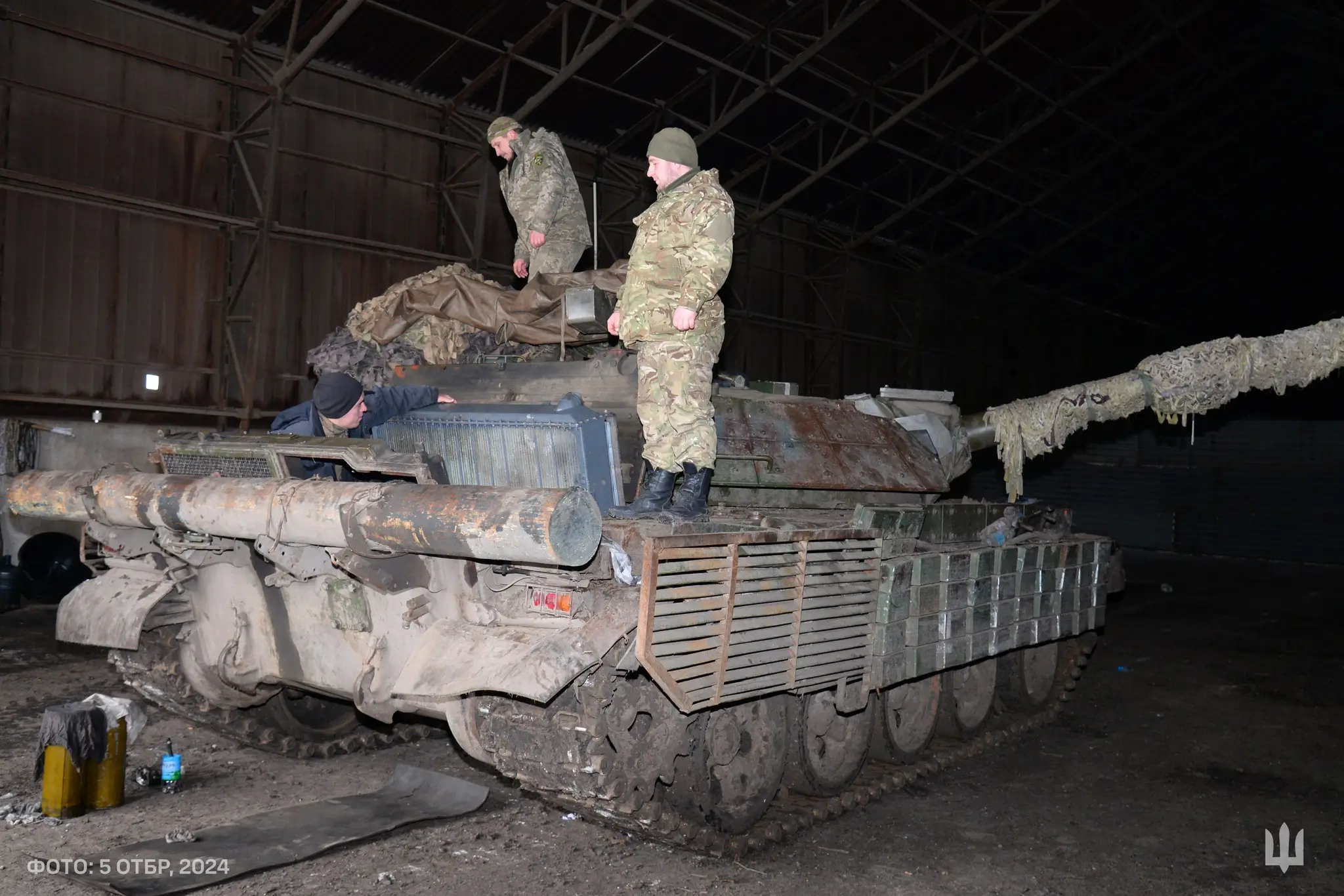 Ukrainian soldiers from the 5th Tank Brigade on top of an M-55S MBT