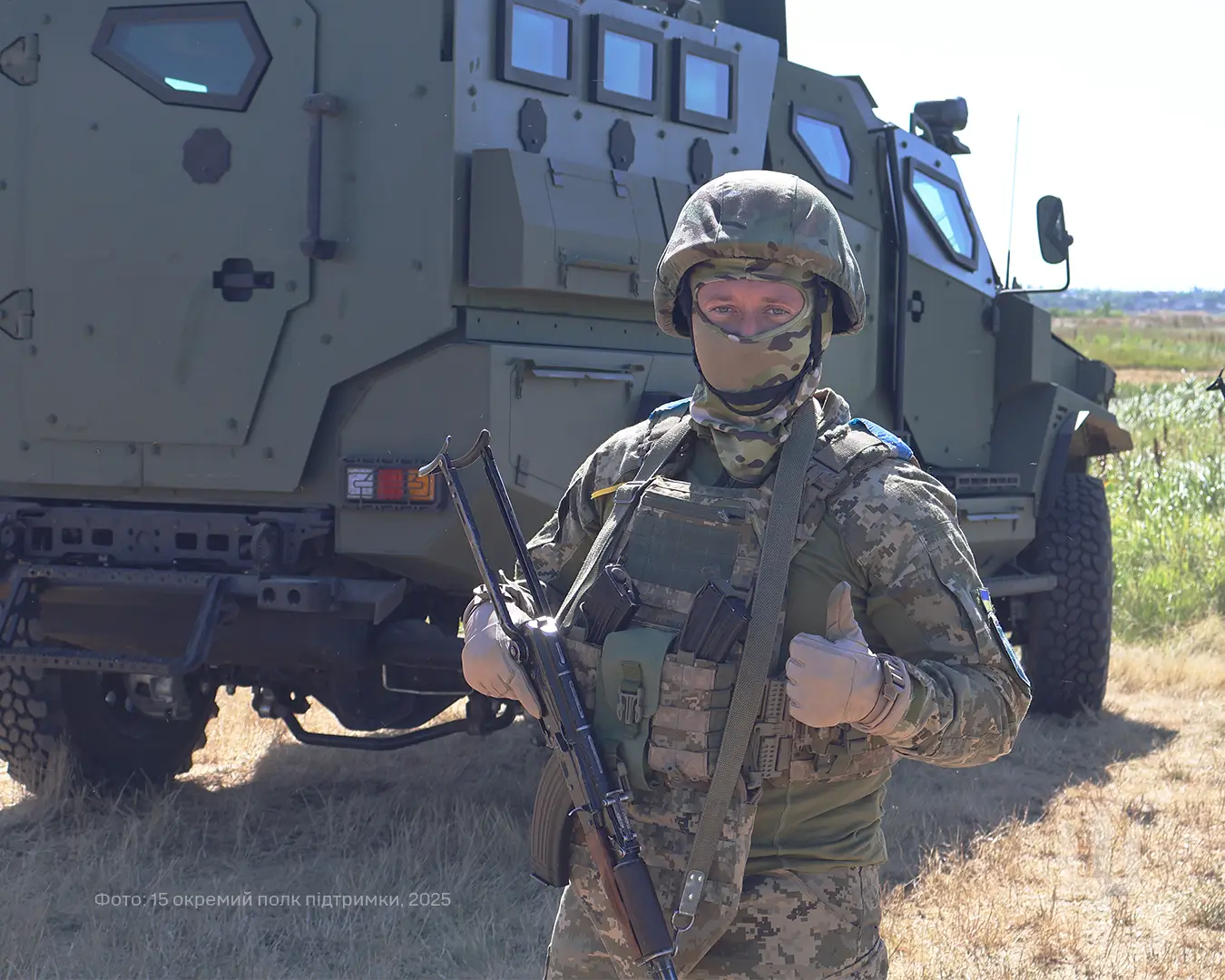 Ukrainian soldier in front of an FFG APC