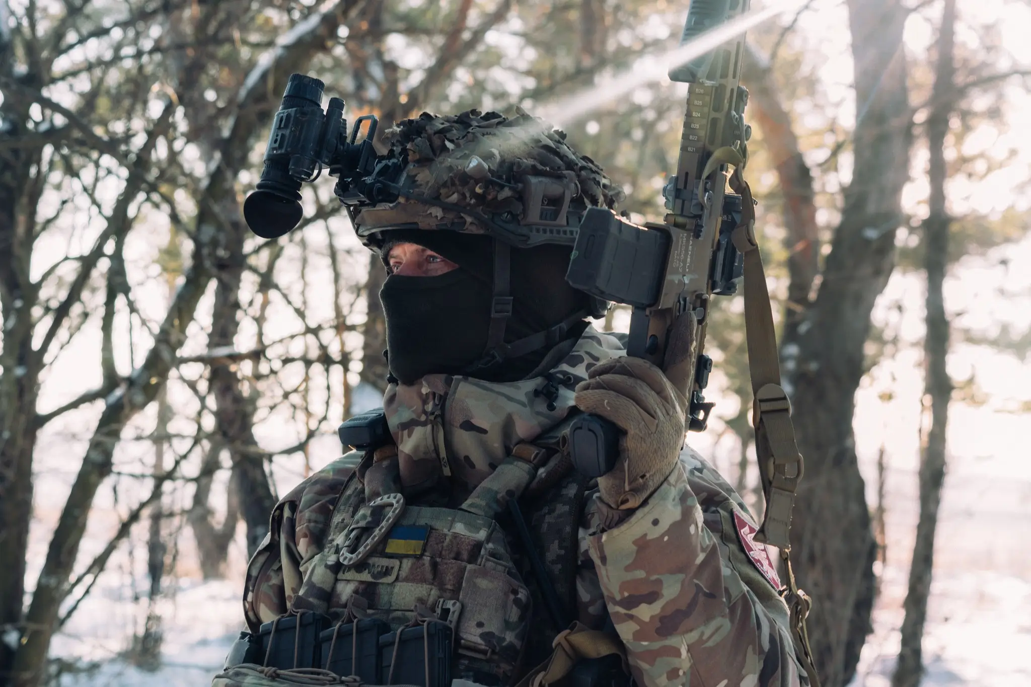 Soldier together with an MK 556 assault rifle