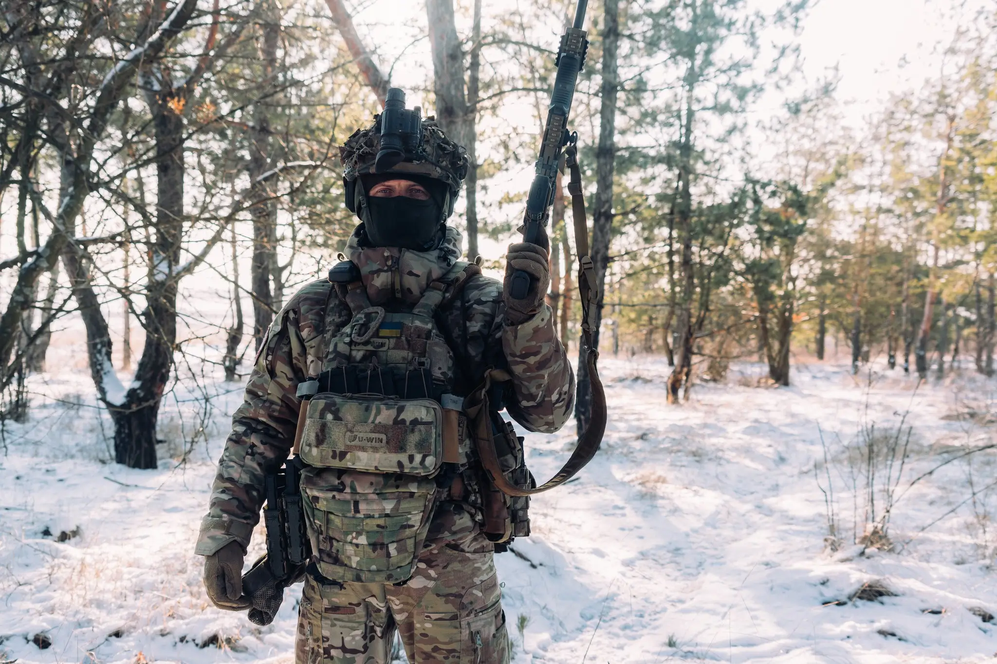 Soldier together with an MK 556 assault rifle