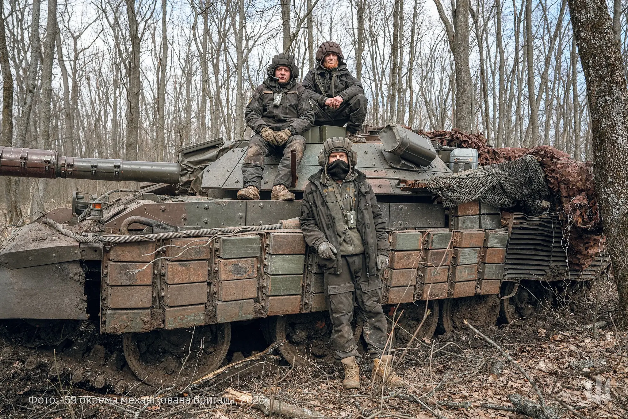 Ukrainian soldiers standing in front of an M-55S