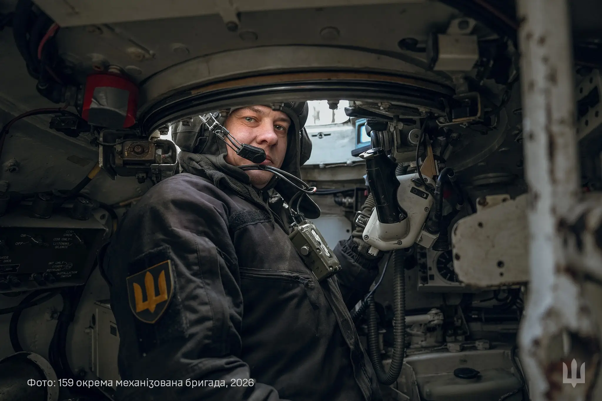 A Ukrainian soldier sits inside an M-55S