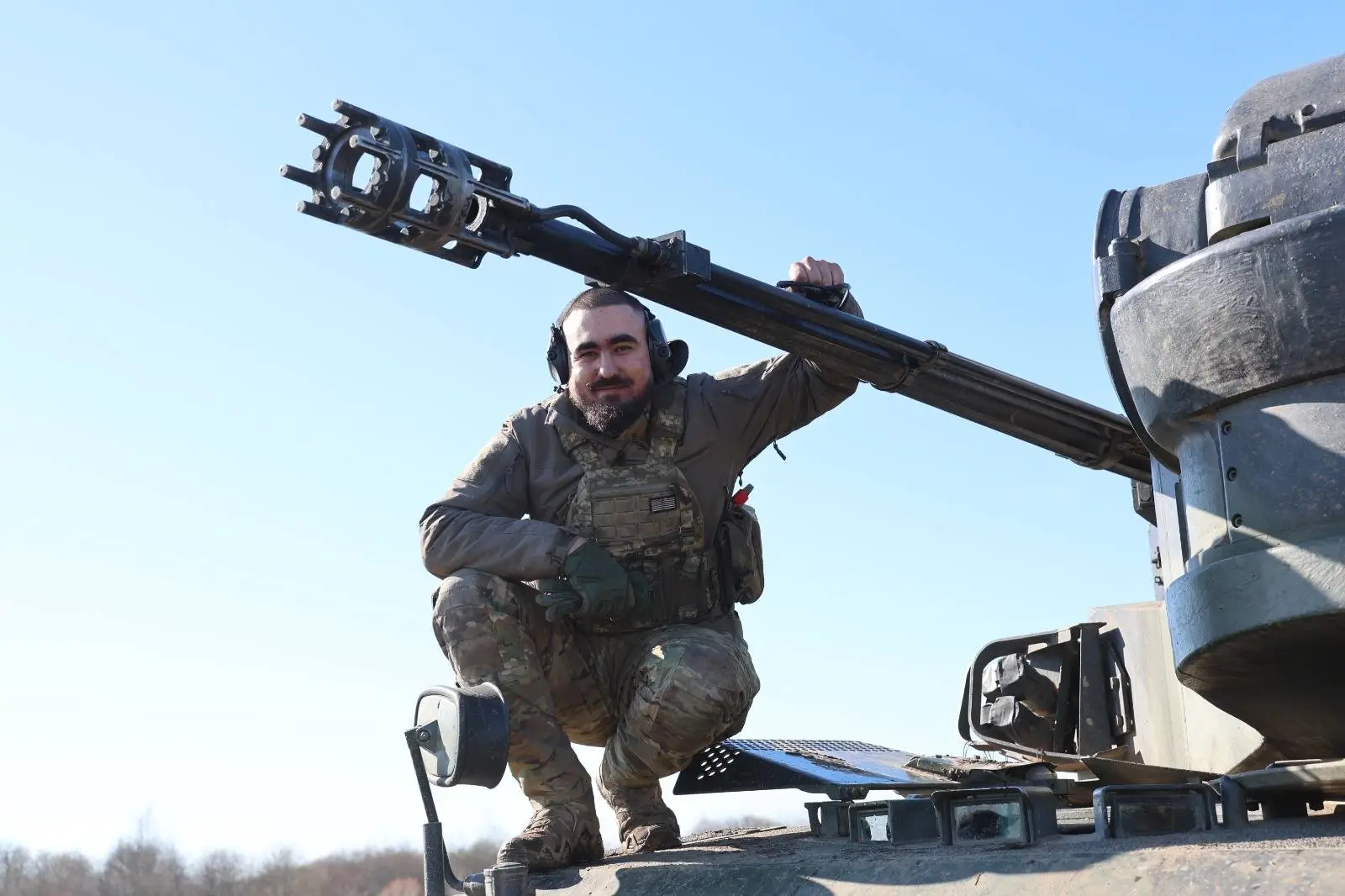 Ukrainian soldier standing on top of a Cheetah SPAAG