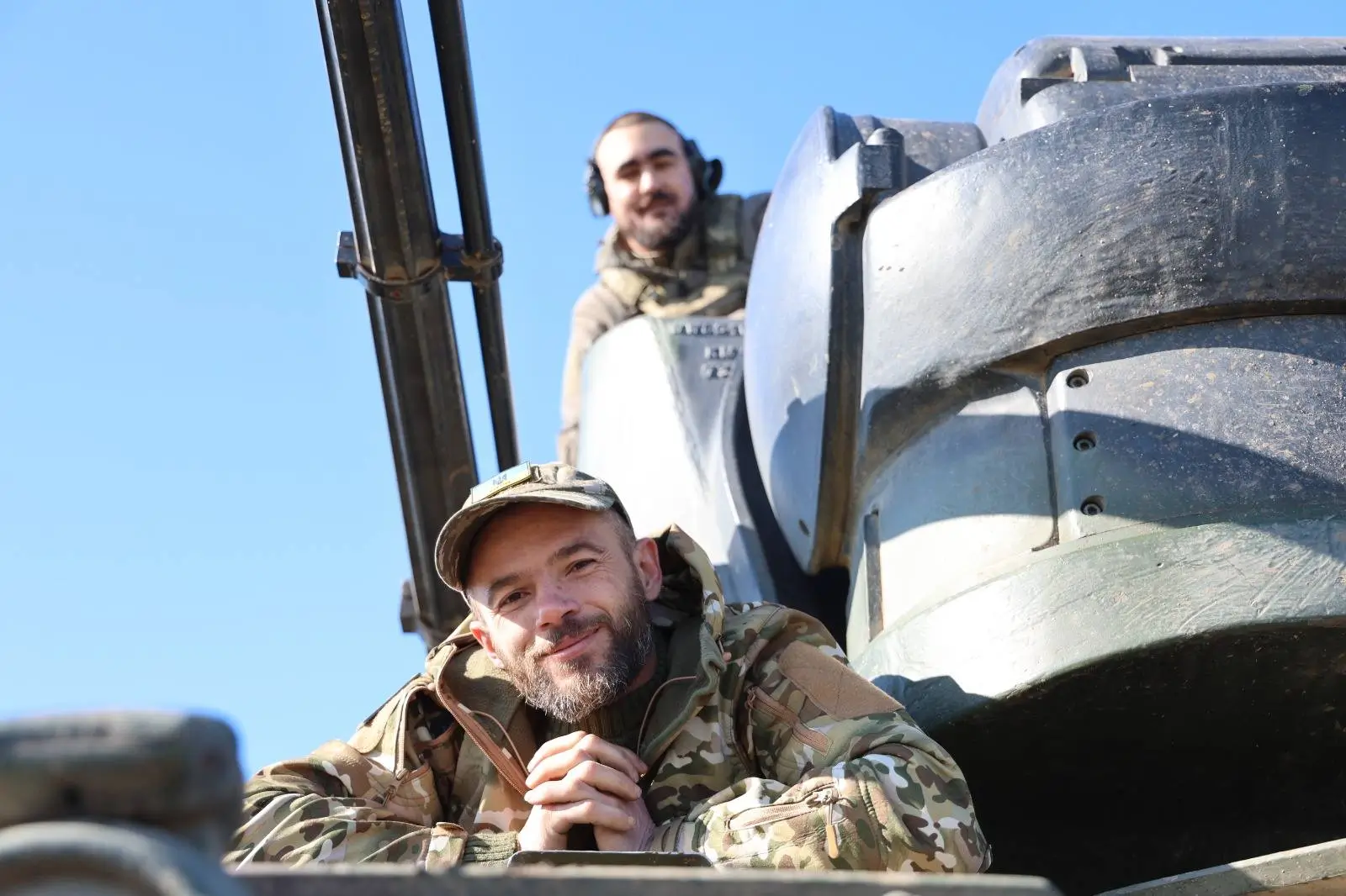 Ukrainian soldiers sitting inside a Cheetah SPAAG